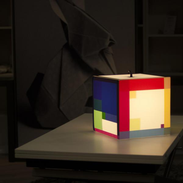 Color out your day light cube lamp on the table with a huge bunny behind it.