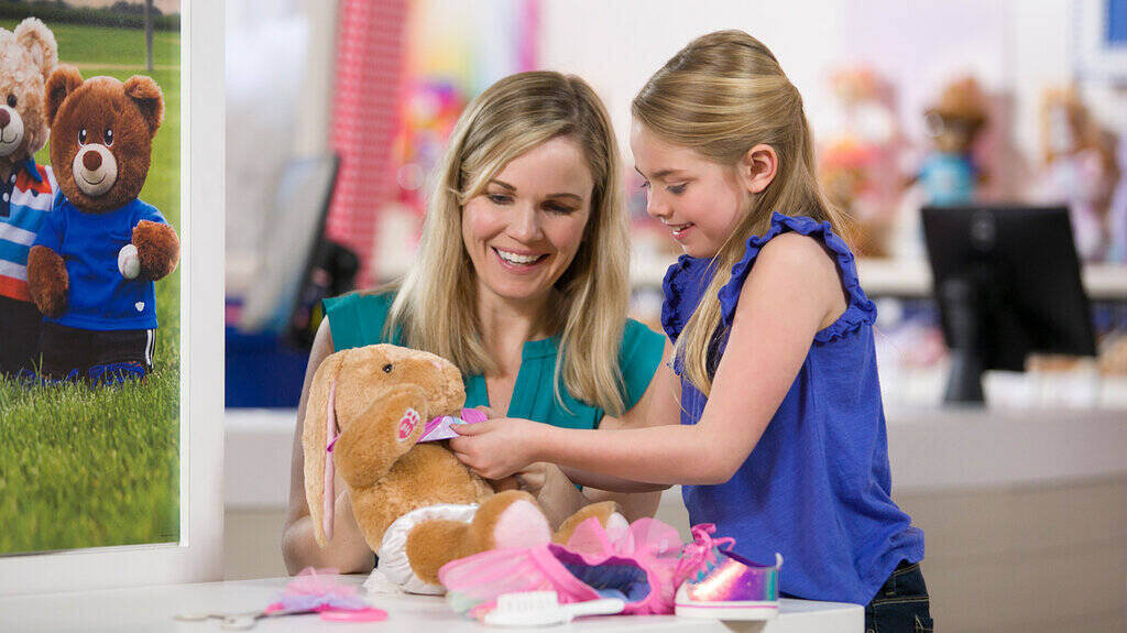 Girl making a personalized teddy bear