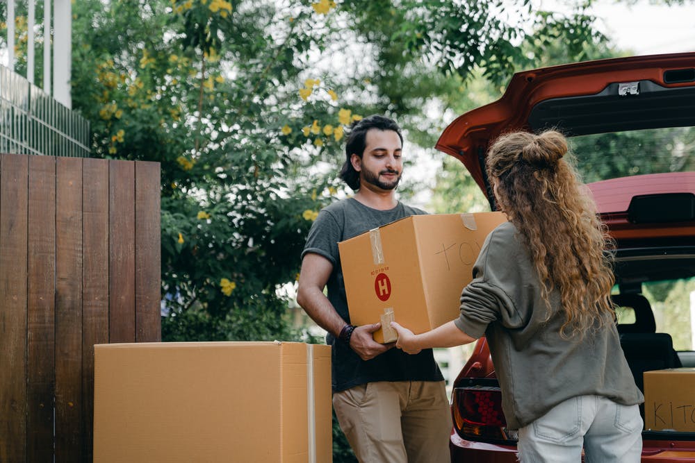 a couple moving houses