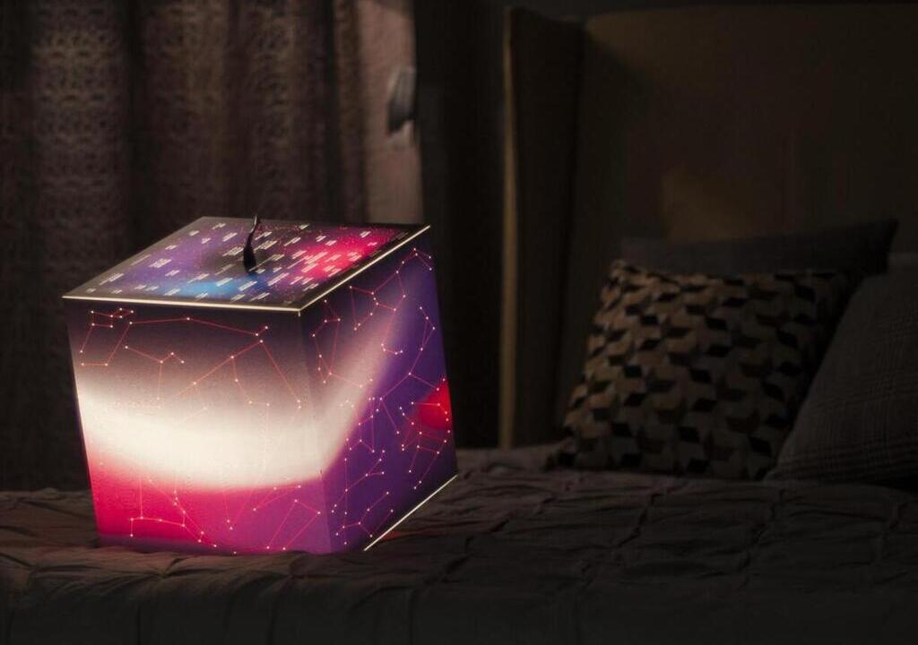 Light up photo cube from uniqcube on a sofa