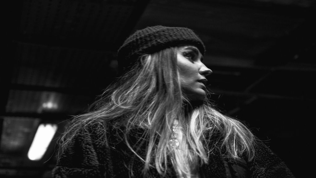 Beanie on a girl as artist merchandise