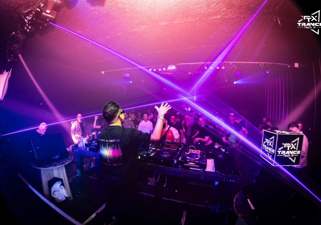DJ Nelzman behind the decks with a custom DJ light box